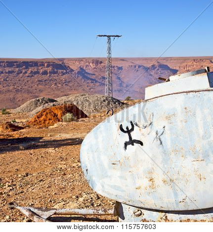 Water Tank In   Utility Pole  Land Gray  Metal Weel And Arid