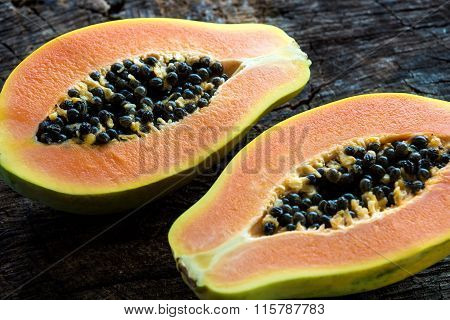Papaya on wooden background