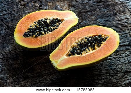 Papaya on wooden background