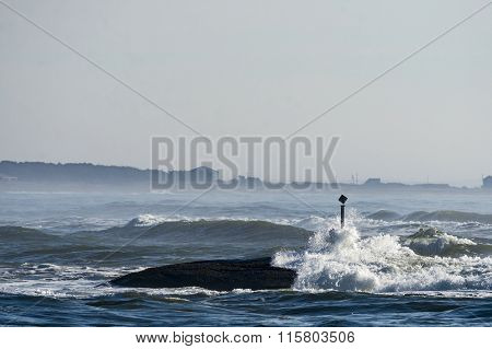 Marker Warns Of Rocks