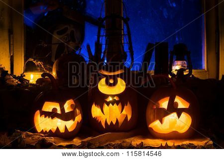 Photo Composition From Three Pumpkins On Halloween
