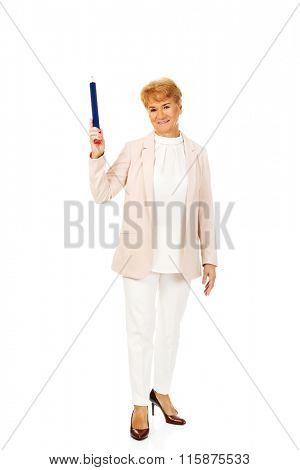 Smile elderly woman pointing up with hege pen
