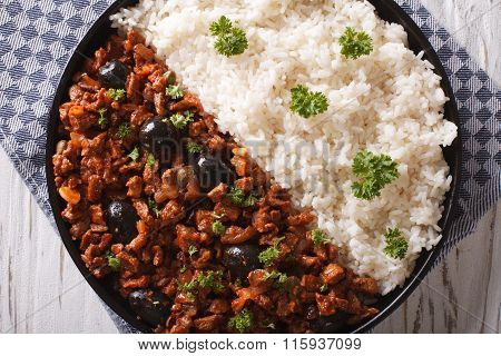 Picadillo A La Habanera With Rice Close-up On The Table. Horizontal Top View