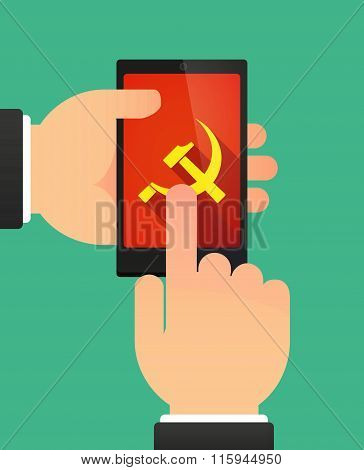 Hands Using A Phone Showing  The Communist Symbol