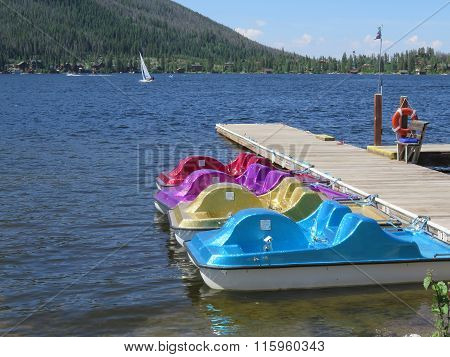 Colorful Paddle Boats Sitting At The Dock
