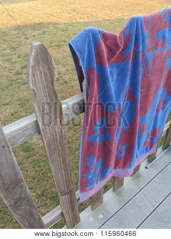 Pool Towel Hanging On A Fence