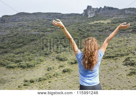 Girl Spreading Her Hands On Mountain Top