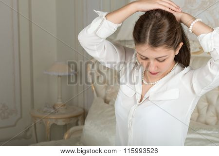 Portrait Of A Cute Girl On The Bed