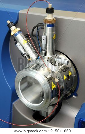 Adjust The Mass Spectrometer. The Man Analyzes The Device For Determining The Masses Of Atoms. Devic