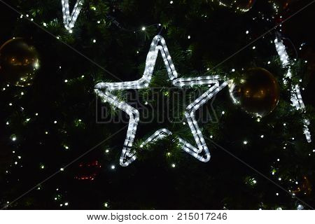Star light Christmas decoration on Christmas tree  background texture