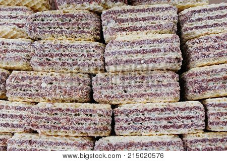 Creamy wafer biscuit texture. Neapolitan wafers are a wafer and chocolate cream sandwich biscuit. Sweets square wafer pattern studio food photography . Stack of wafers.