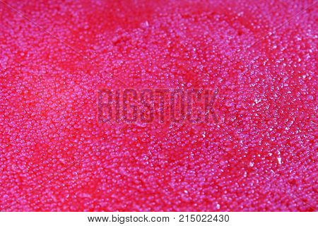 Red caviar studio photo. Caviar texture pattern background food closeup wallpaper. Healthy sea food. Orange or red luxury caviar as background. Red mini caviar.