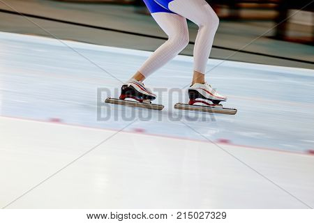 woman legs athlete speed skater in ice rink