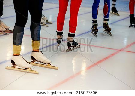 starting line legs men athletes speed skaters in mass start