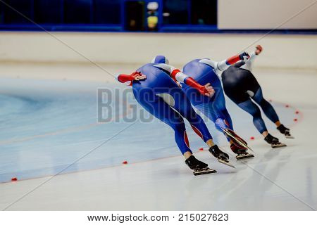 back three women athletes speed skaters in warm up