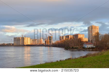 View of Neva River on the outskirts of St. Petersburg at sunny autumn evening Russia.
