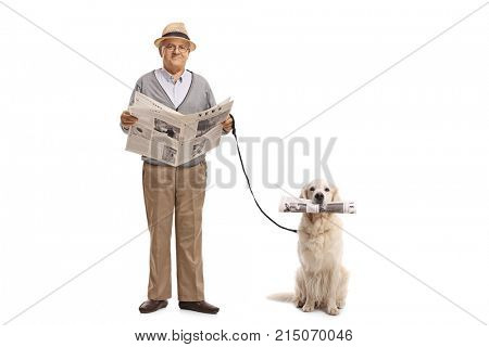 Full length portrait of a senior holding a newspaper and a labrador retriever dog with a newspaper isolated on white background