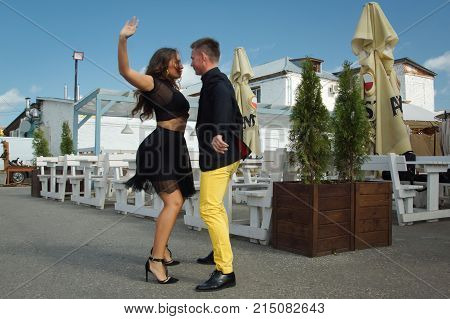Couple Of Dancers Dancing Bachata On A City Street