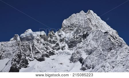 High mountains Kangtega and Thamserku. View from Khumjung Nepal.