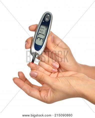 First type Diabetes patient measuring glucose level blood test use glucometer and small drop of blood from finger and test strips isolated on a white background