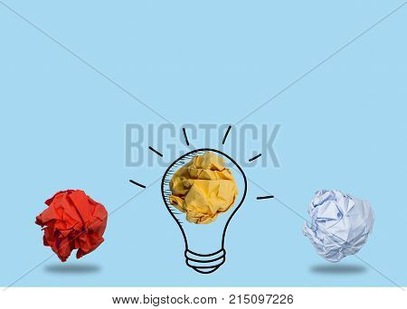 Creativity inspiration,ideas concepts with lightbulb and paper crumpled ball on  color blue background.Flat lay design.