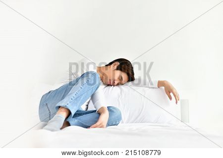 Men are playing mobile in the bedroom.