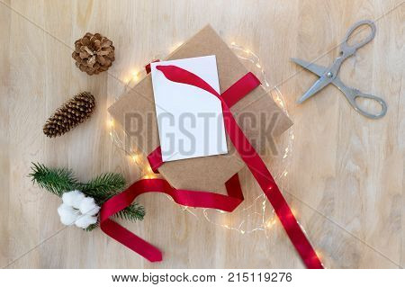 Homemade Wrapped Christmas Present With Tools And Decorations. Top View. Packing Christmas Gifts.