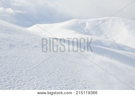 Carpathian mountain landscape. Panorama of Snow Mountain. Snow mountains on bright winter day