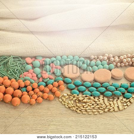 Set of vintage costume jewellery beads necklaces bracelets scarf. Top view flat lay