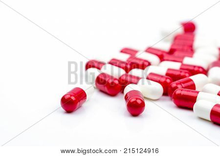 Selective focus of antibiotic capsules pills on white background with copy space. Drug resistance concept. Antibiotics drug use with reasonable and global healthcare concept.