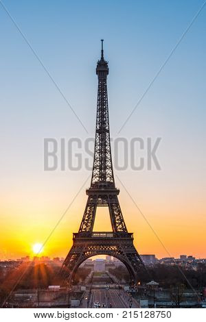 Landscape View Of A Warm Sunrise Over Paris And The Eiffel Tower With A Beautiful Orange To Blue Gra