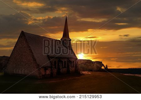 Sunset On The Unique Church Of Notre Dame De La Garde In Etretat Cliff At The French Normandy Beach