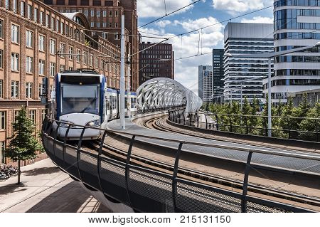 Intercity tram from Alstom running on an aerial tram station and plateforme in The Hague Netherlands