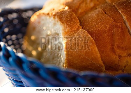Tasty Loaves Of Traditional Homemade Bread In Blue Wooden Basket