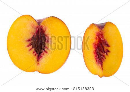 Sliced slices of fresh ripe peach on white background. Studio Photo