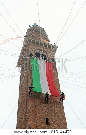 Vicenza, Vi, Italy - December 4, 2015: Firefighters With A Big Italian Flag On An Ancient Palace Cal