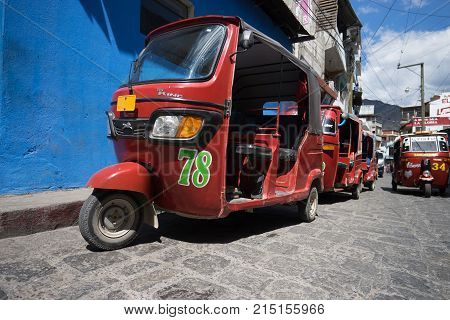 April 6,2016, San Pedro la Laguna,Guatemala: tuktuks lining up waiting for customers beside the local market very popular as a low budget transportation