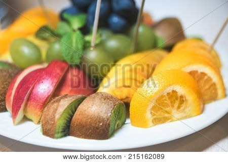 Sweets fruit Oranges apples grapes ,kivi, yellow, green