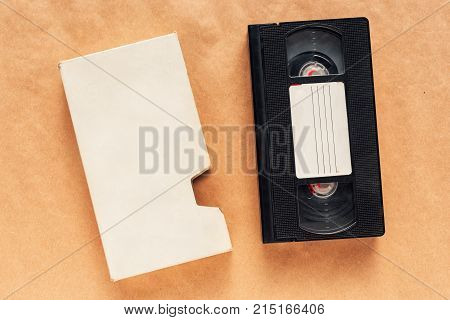 Blank used video casette tape retro technology. Video home system (VHS) recording tape with blank warapper as copy space.