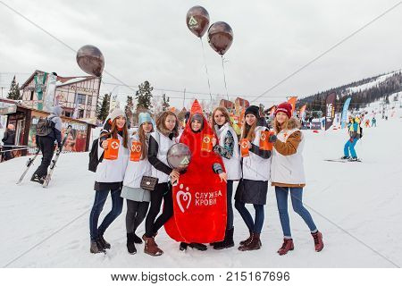 Sheregesh, Kemerovo region, Russia - April 22, 2017: Grelka Fest is a sports and entertainment activity for ski and snowboard riders in carnival costume. Young people in carnival costumes.
