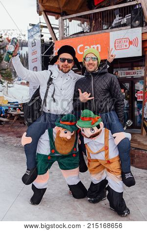 Sheregesh, Kemerovo region, Russia - April 22, 2017: Grelka Fest is a sports and entertainment activity for ski and snowboard riders in carnival costume. Young people in carnival costumes.