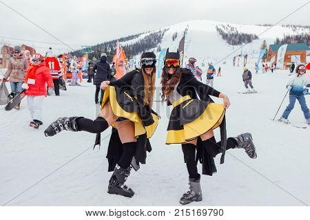 Sheregesh, Kemerovo region, Russia - April 22, 2017: Grelka Fest is a sports and entertainment activity for ski and snowboard riders in carnival costume. Two girls in a costumes of Batman.