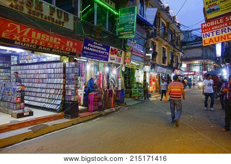 THAMEL, KATHMANDU NEPAL - OCTOBER 02, 2017: Unidentified people walking and buying in the streets of Thamel. Thamel is a commercial neighbourhood in Kathmandu, the capital of Nepal. One of the popular tourist attraction in Kathmandu.