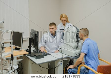Young Beautiful Doctor/eye Specialist/optometrist In An Ophthalmologic Clinic