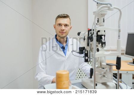 Young Beautiful Doctor/eye Specialist/optometrist In An Ophthalmologic Clinic