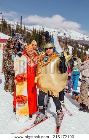 Sheregesh, Kemerovo region, Russia - April 22, 2017: Grelka Fest is a sports and entertainment activity for ski and snowboard riders in carnival costume. Young people in carnival costumes.