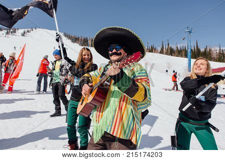 Sheregesh, Kemerovo region, Russia - April 22, 2017: Grelka Fest is a sports and entertainment activity for ski and snowboard riders in carnival costume. Man in carnival costume of mexican man.