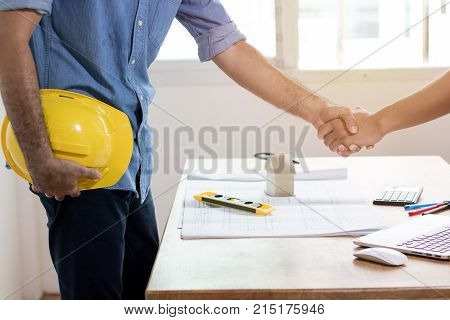 Teamwork concept Architecture team shaking hand in building constraction