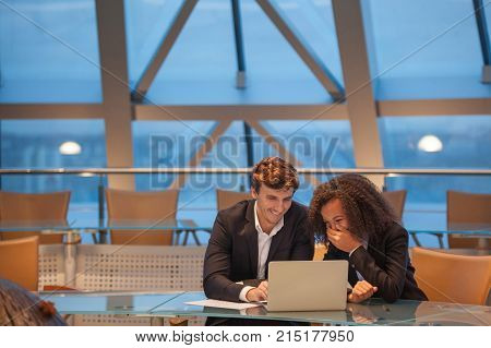 Business people having meeting around table in modern office.