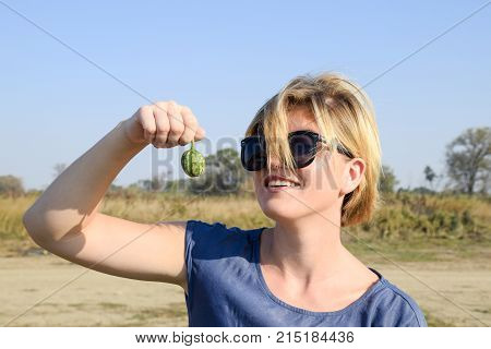 Girl With A Small Watermelon In Her Hand. The Embryo Of Watermelon.